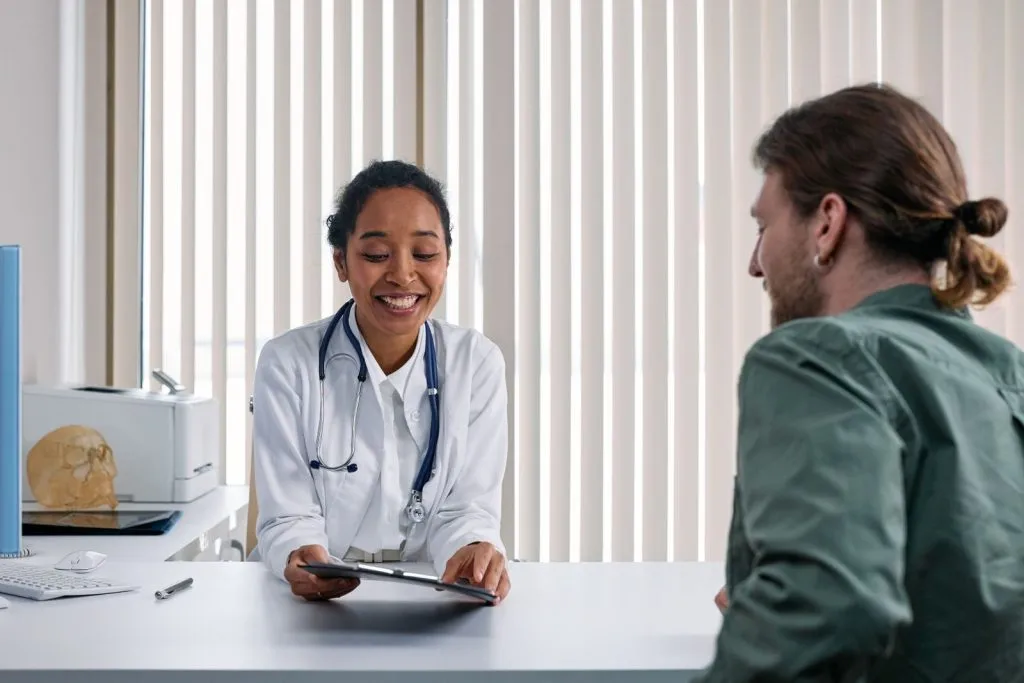 Doctor speaking with a patient in a modern clinic