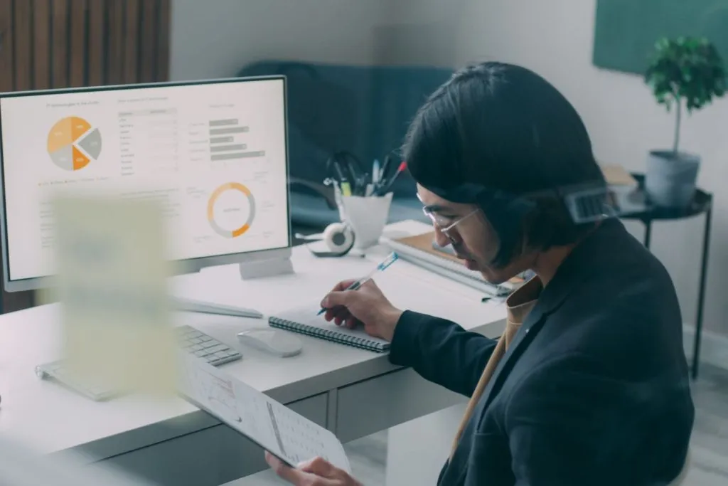 Reviewing marketing analytics and lead reports at a desk