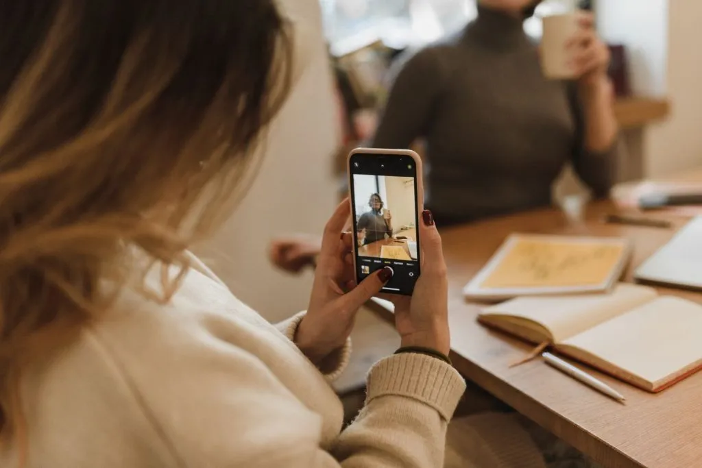 Business owner creating social media content on a phone